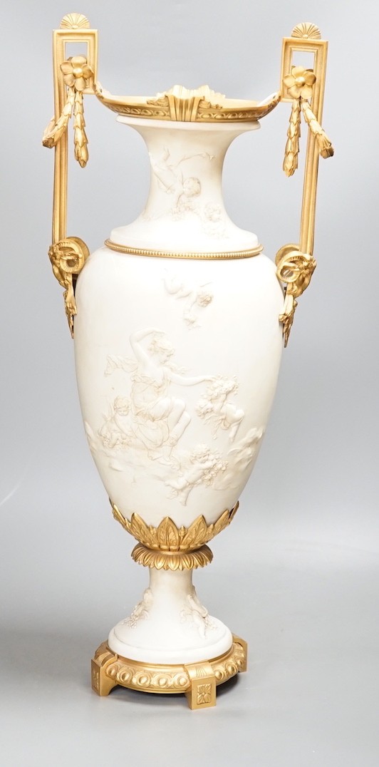 A large Louis XVI style ormolu mounted biscuit porcelain urn - 63cm tall